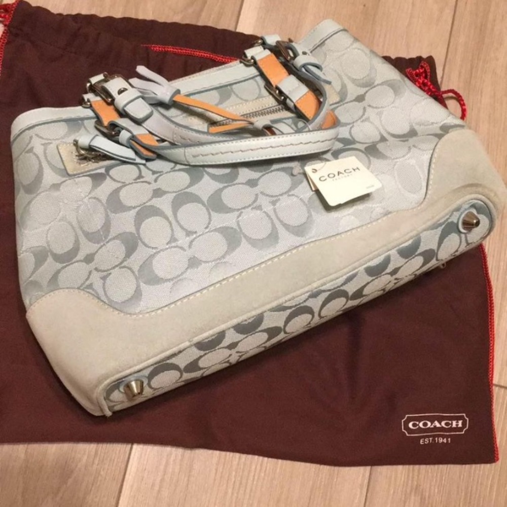 Beautiful baby blue signature coach purse